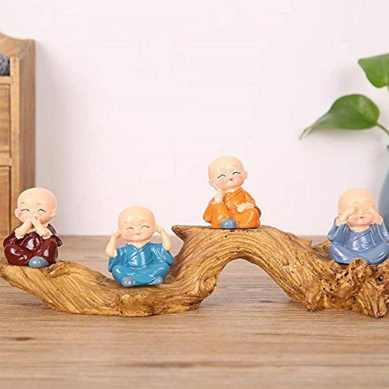 Multicolor Polyresin cute monks sitting on a Trunk - Green Ninja