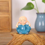Multicolor Polyresin cute monks sitting on a Trunk - Green Ninja