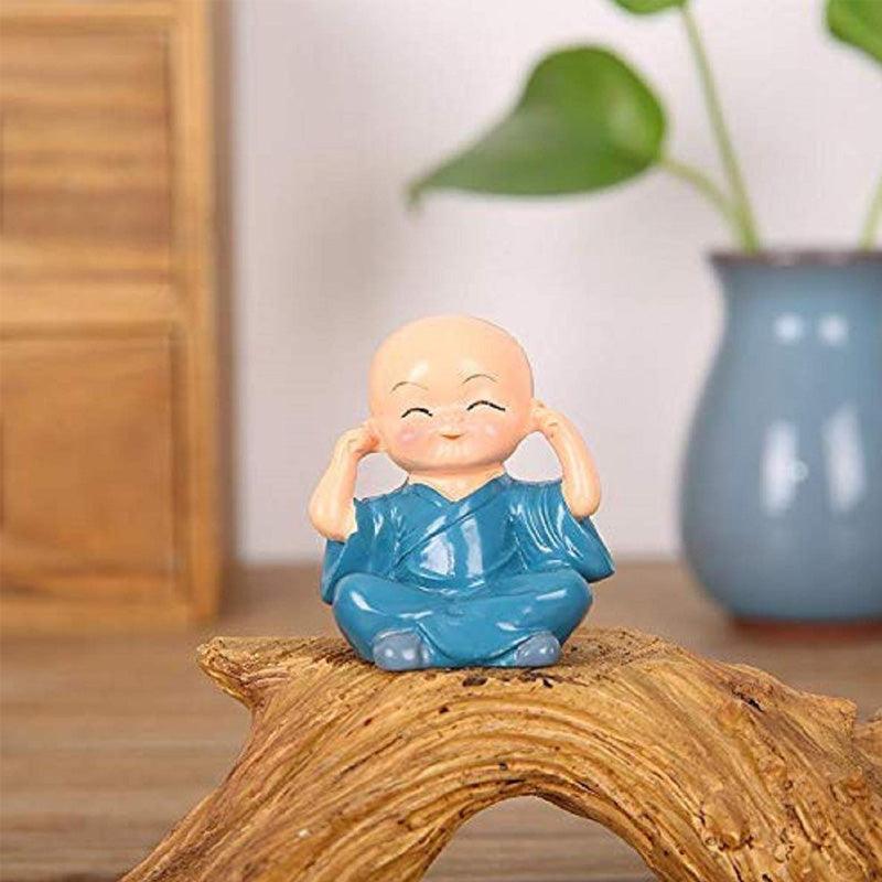 Multicolor Polyresin cute monks sitting on a Trunk - Green Ninja