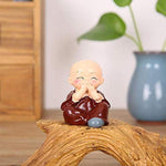 Multicolor Polyresin cute monks sitting on a Trunk - Green Ninja