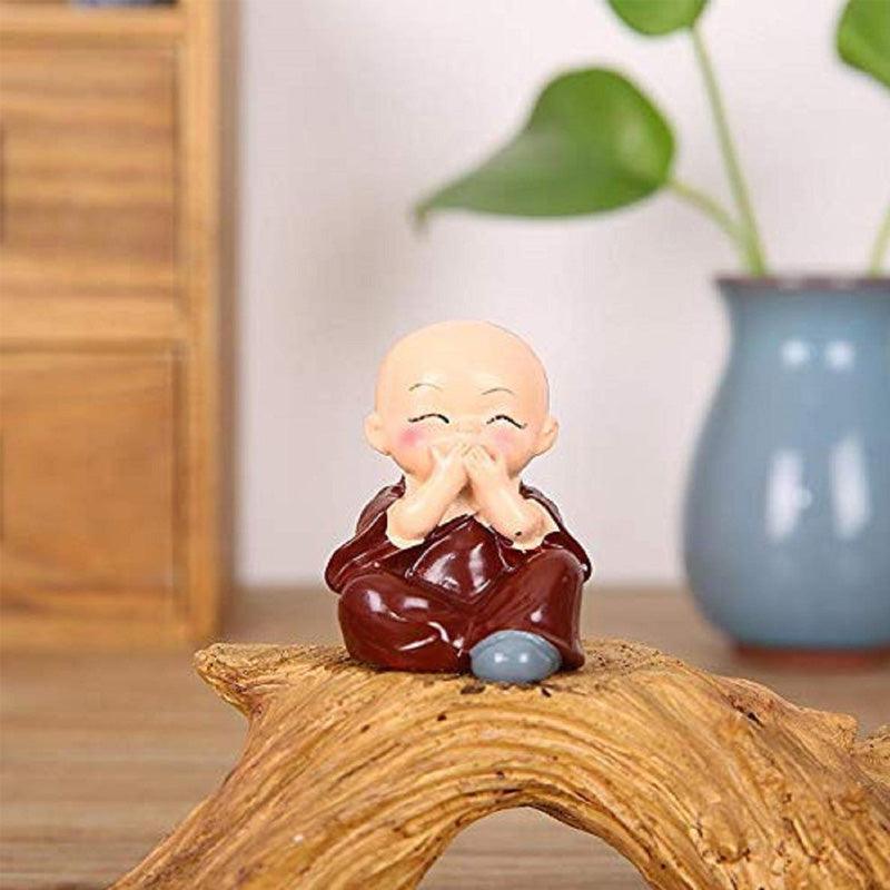 Multicolor Polyresin cute monks sitting on a Trunk - Green Ninja