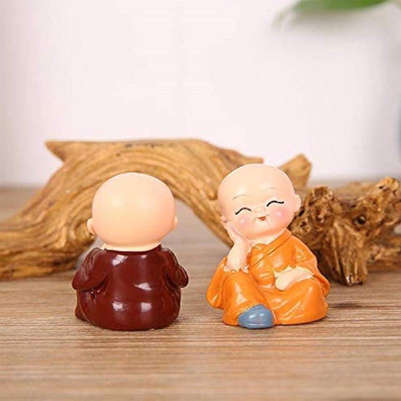 Multicolor Polyresin cute monks sitting on a Trunk - Green Ninja